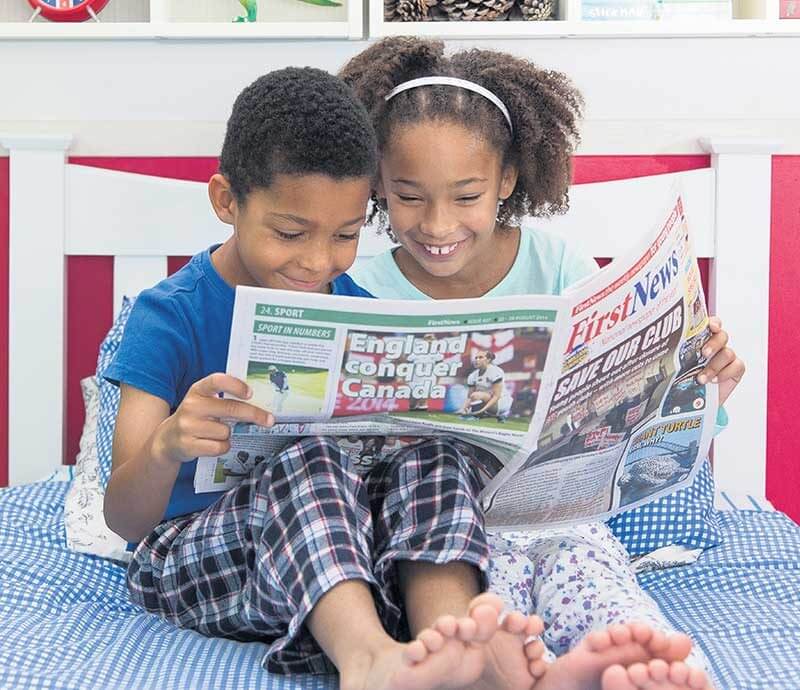 children reading frst news (1)